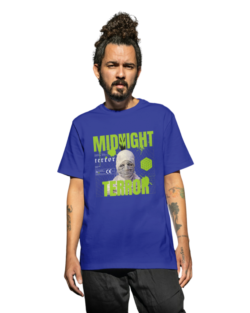 Blue oversized streetwear T-shirt featuring Midnight Terror graphic print with mummy artwork and neon green typography.